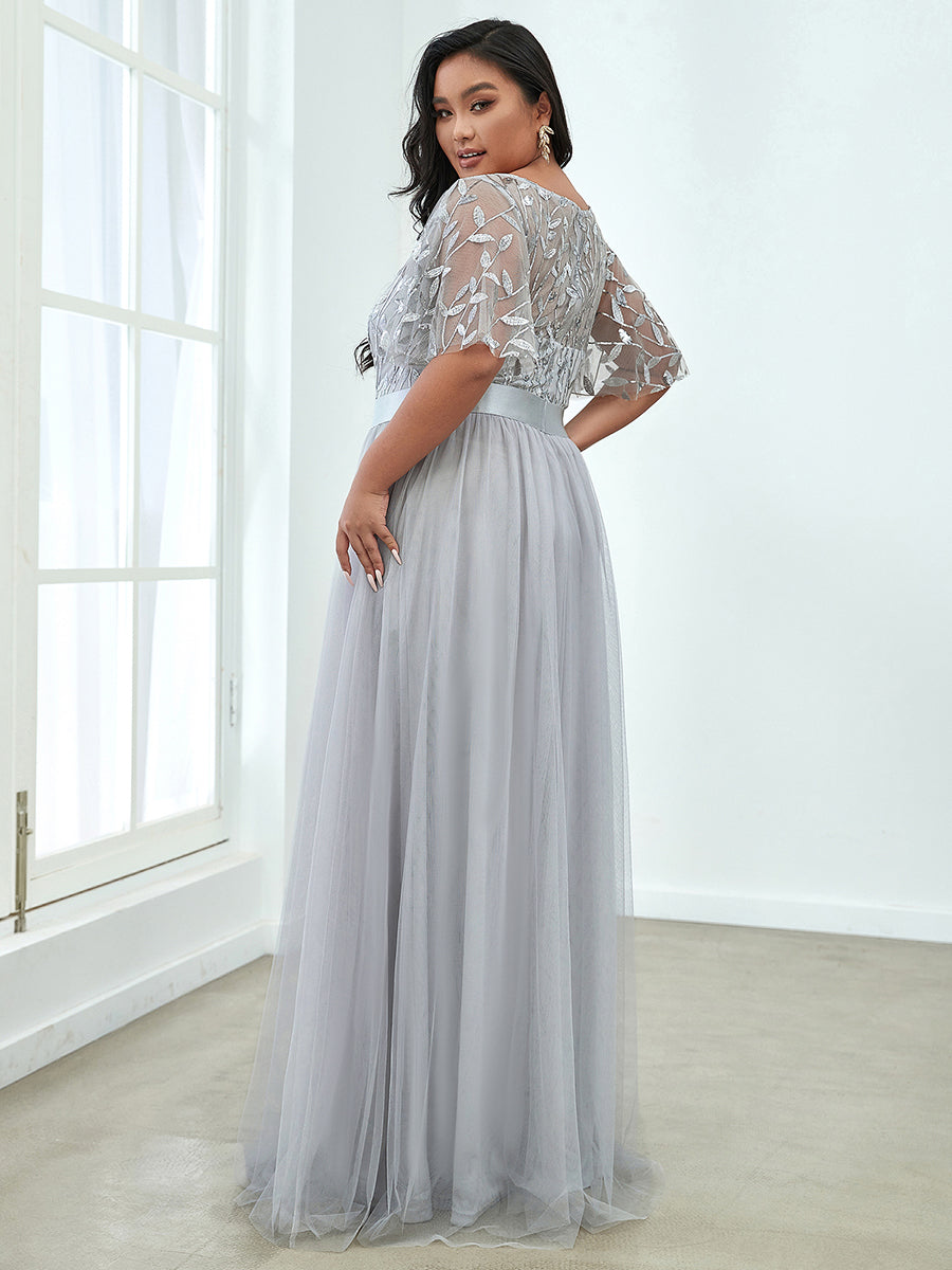 Shimmering Evening Gown with Ruffle Sleeves and Belt Detail